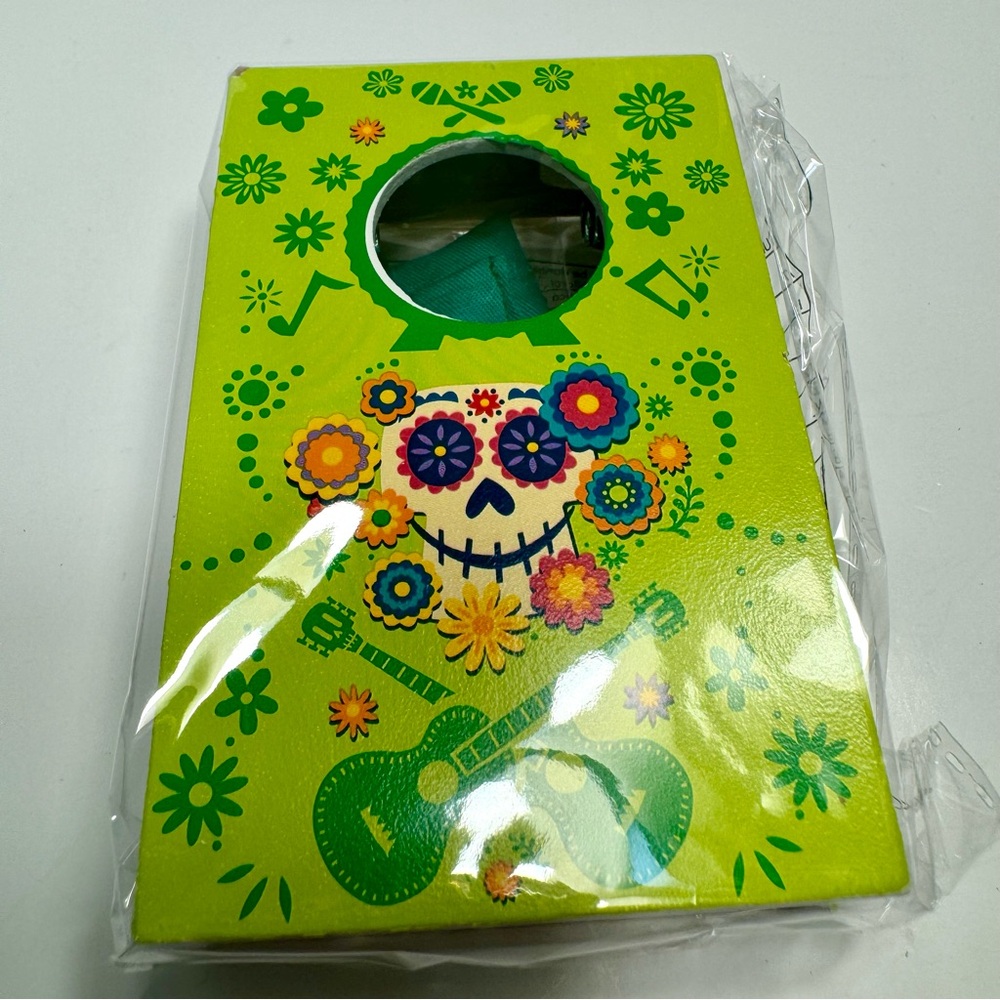 NWT. Disney Parks Epcot Flower Garden Prize Corn Hole game Coco theme.